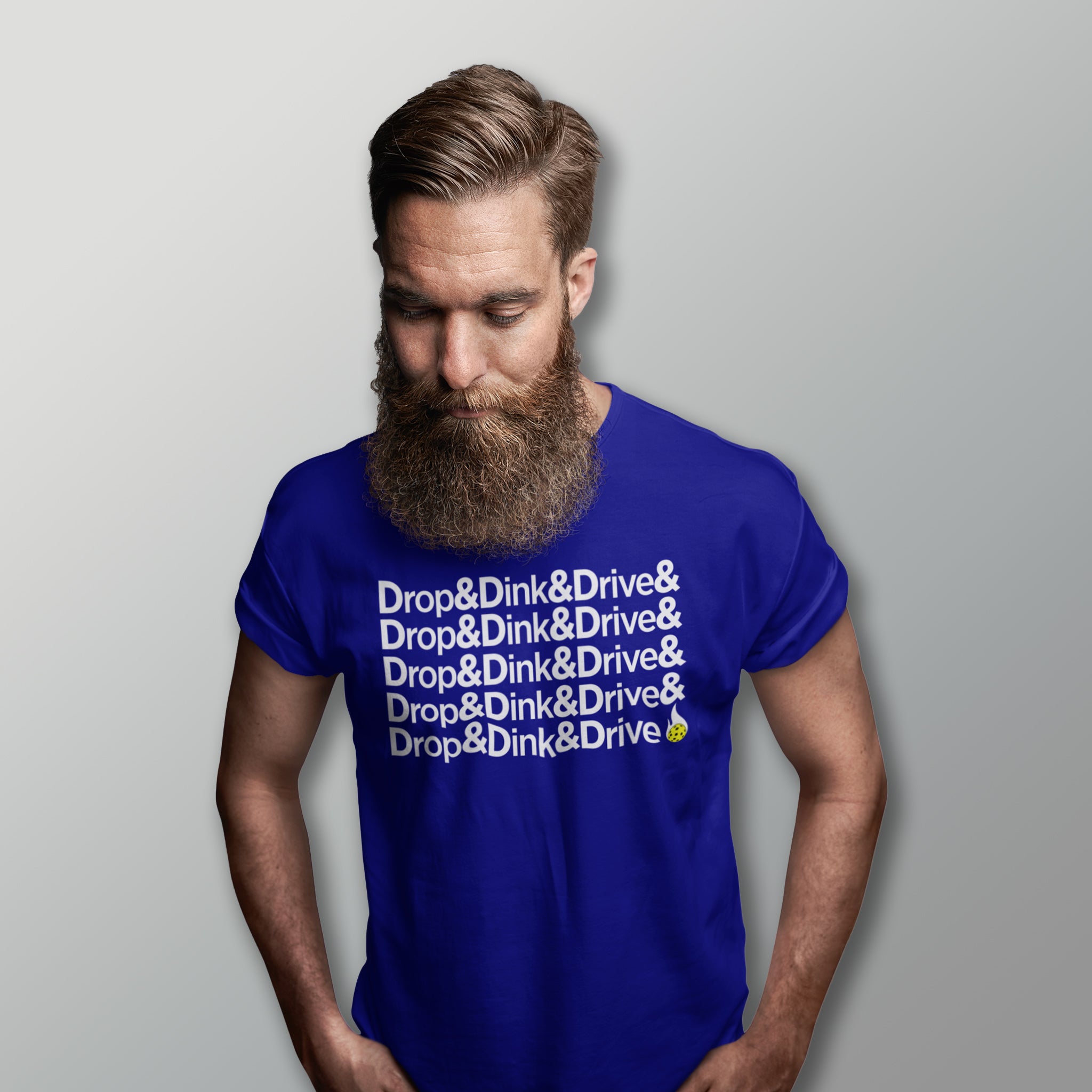 man with long beard wearing royal blue drop & dink & drive pickleball apparel shirt front view