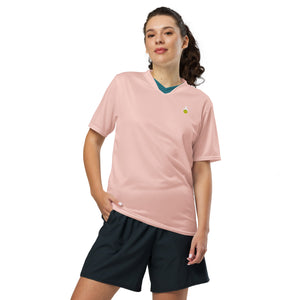 smiling woman wearing pink match point pickleball shirt performance apparel athletic top phenom logo front view