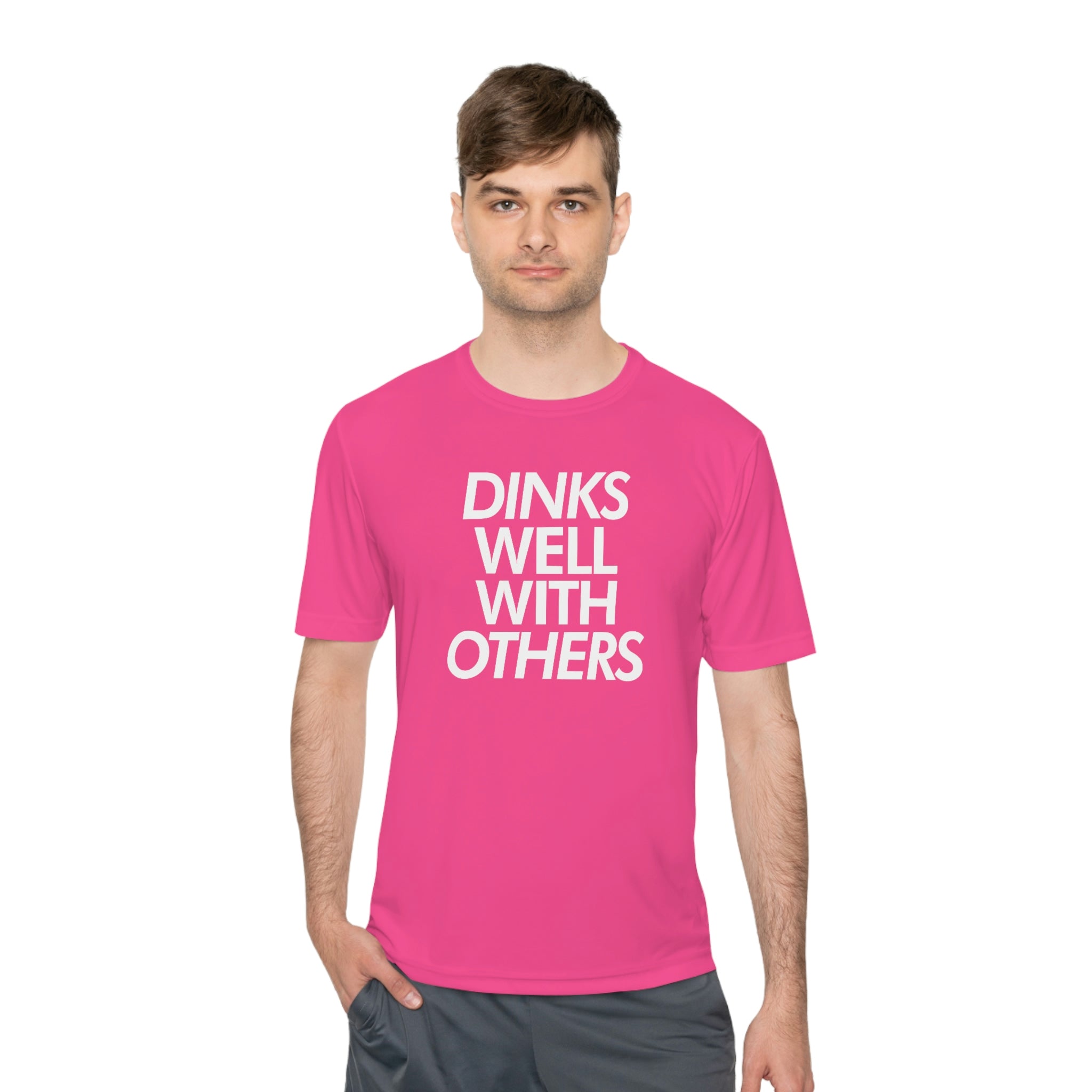 man wearing hot neon pink dinks well with others athletic performance pickleball shirt apparel front view