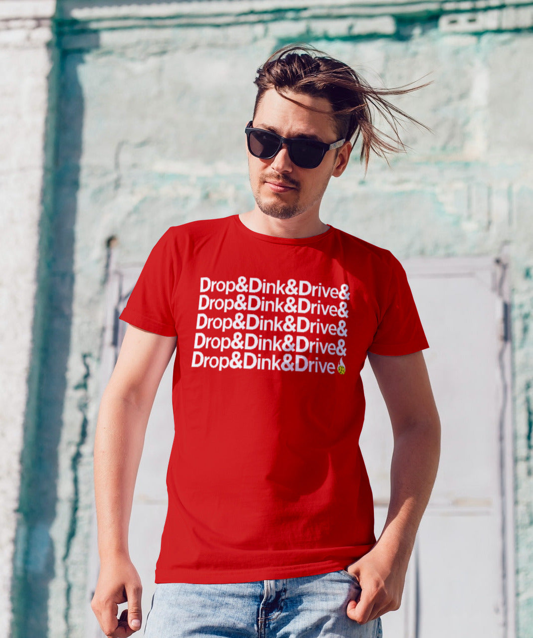 man with sunglasses on wearing red drop & dink & drive pickleball apparel shirt front view
