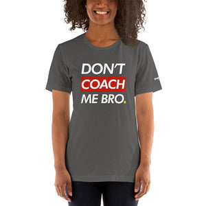 smiling woman with curly hair wearing dark gray don't coach me bro pickleball shirt apparel front view