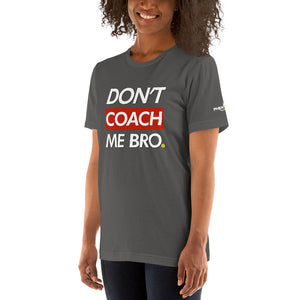 smiling woman with curly hair wearing dark gray don't coach me bro pickleball shirt apparel left side front view