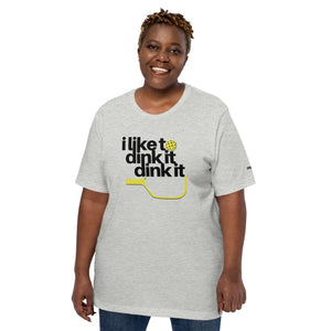 plus sized smiling woman wearing heather gray i like to dink it dink it pickleball apparel athletic performance shirt front view