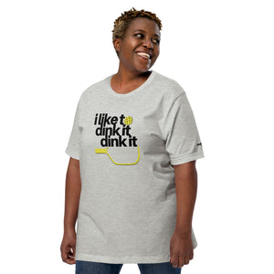 smiling plus sized woman wearing heather gray i like to dink it dink it pickleball apparel athletic performance shirt left front view