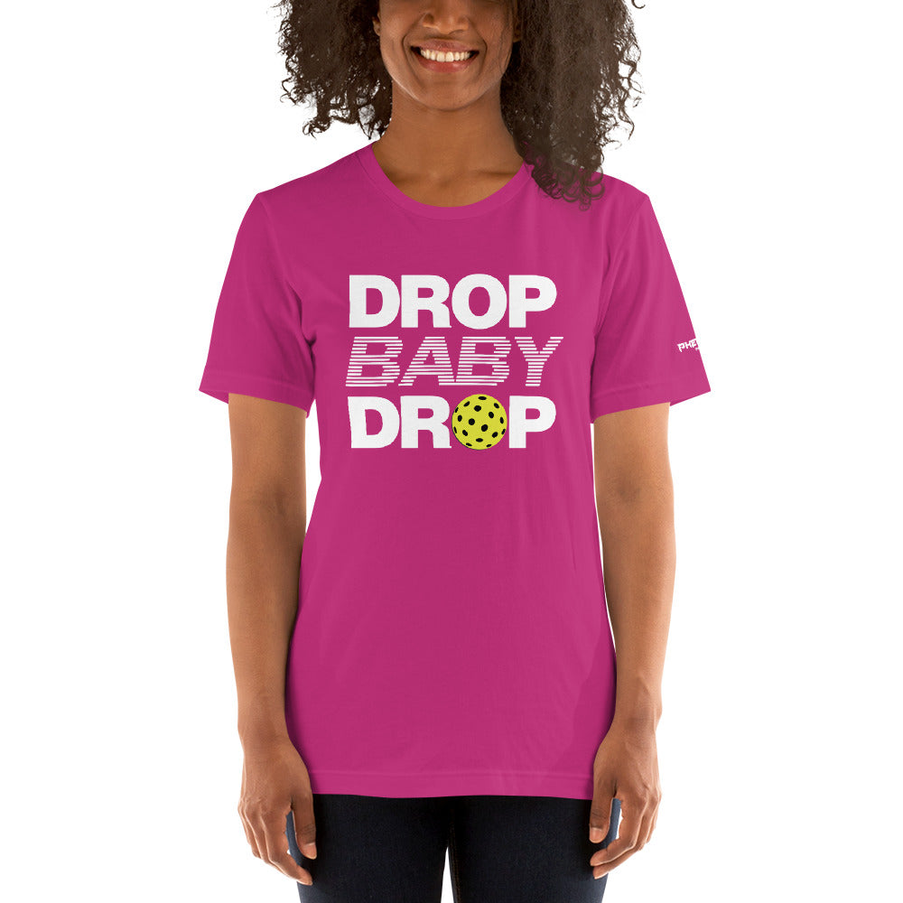 smiling woman wearing magenta hot pink drop baby drop pickleball shirt apparel front view