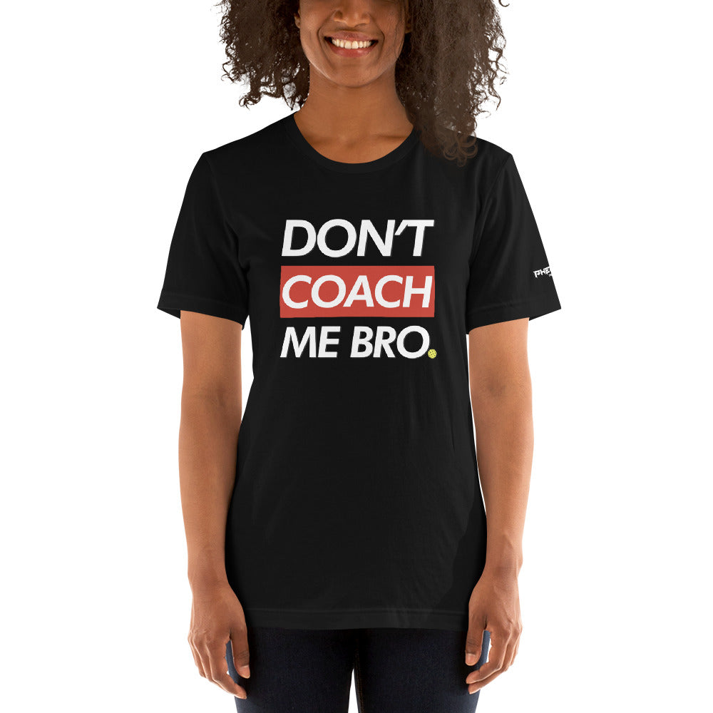 smiling woman with curly hair wearing black don't coach me bro pickleball shirt apparel front view