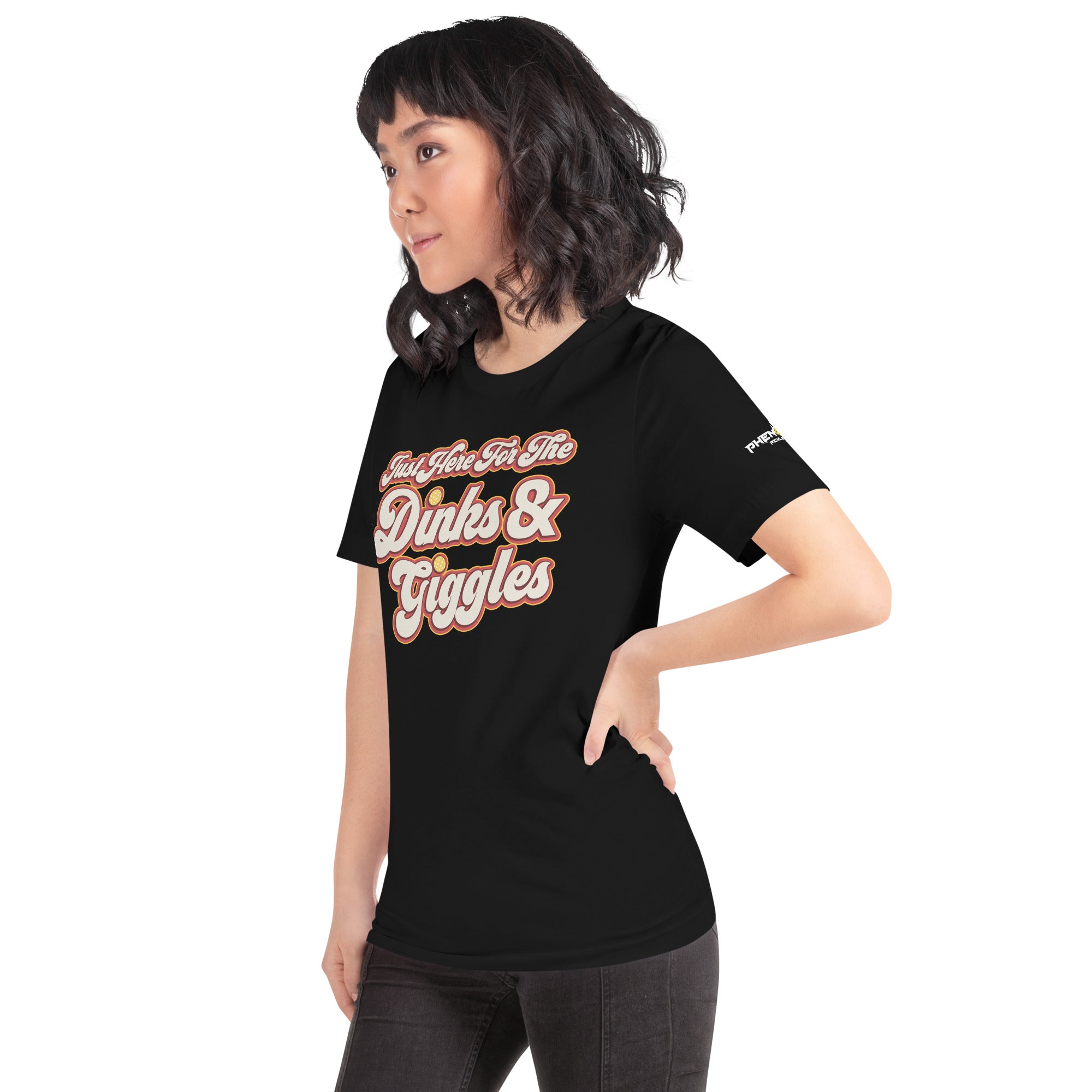 petite asian woman wearing black just here for the dinks and giggles pickleball shirt apparel left side view