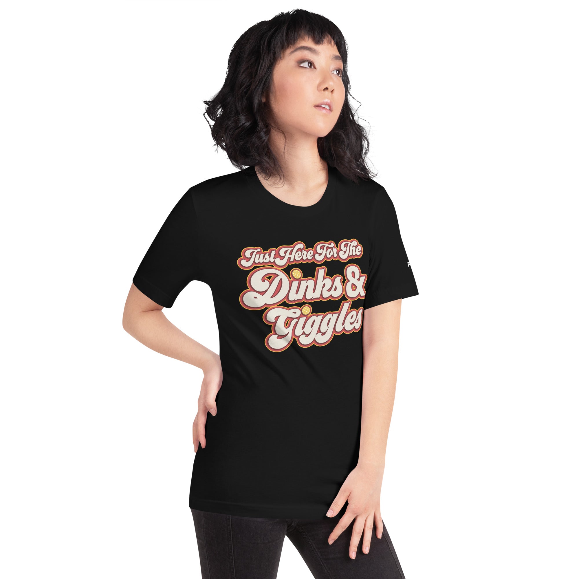 petite asian woman wearing black just here for the dinks and giggles pickleball shirt apparel right side front view