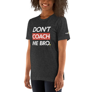 smiling woman with curly hair wearing heather dark gray don't coach me bro pickleball shirt apparel left side front view