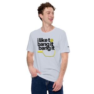 smiling man in dark blue jeans wearing light blue i like to bang it bang it pickleball shirt athletic performance apparel front view
