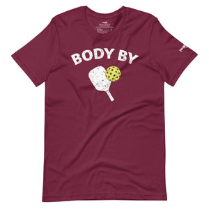 maroon body by pickleball shirt apparel with paddle and ball weathered look front view
