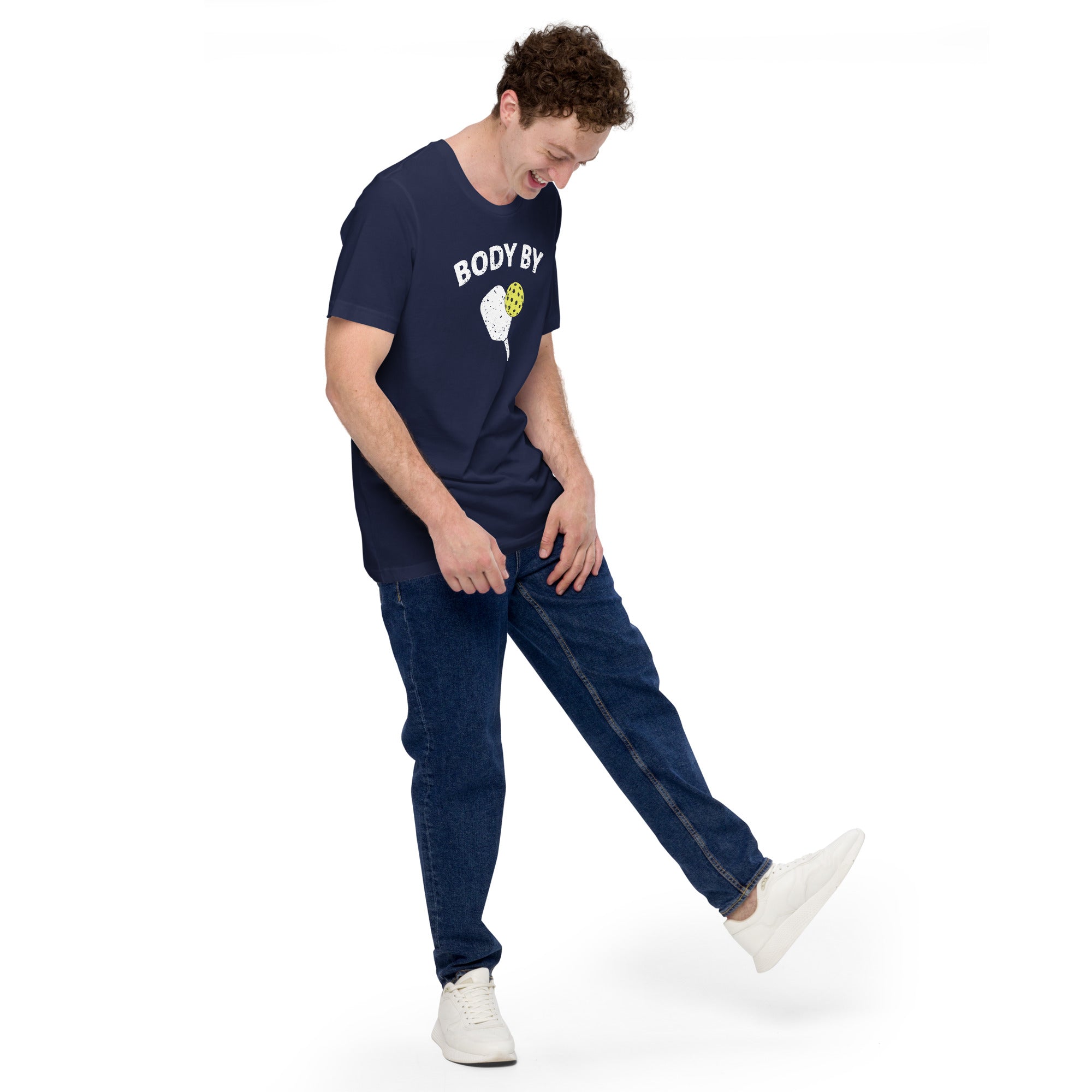 man looking down wearing navy blue body by pickleball shirt apparel with paddle and ball weathered look right side view