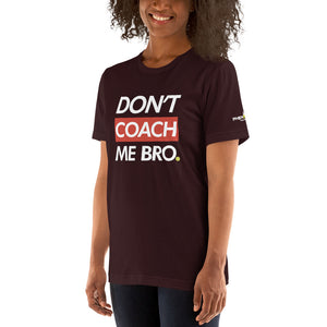 smiling woman with curly hair wearing dark maroon burgundy don't coach me bro pickleball shirt apparel left side front view