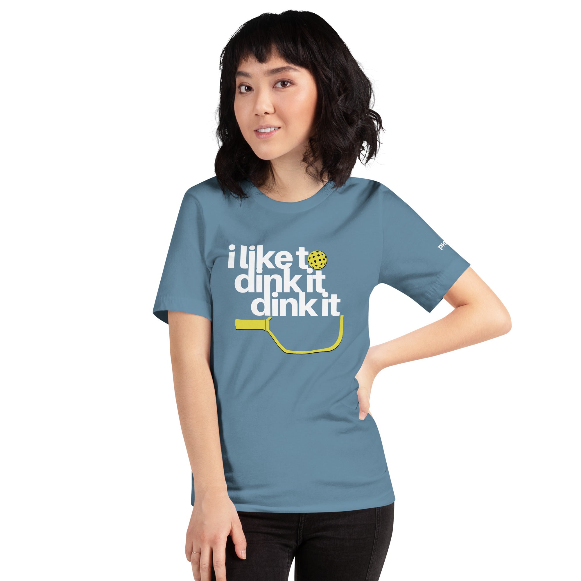 smiling petite asian woman wearing steel blue i like to dink it dink it pickleball apparel athletic performance shirt front view