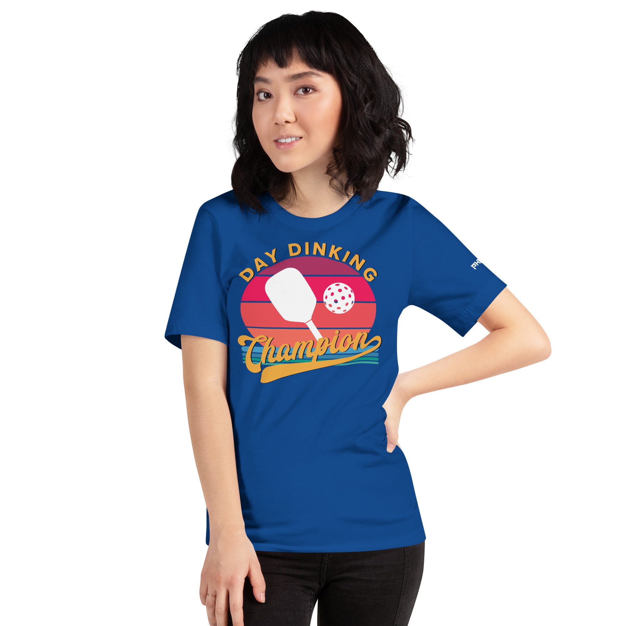 smiling asian petite woman wearing royal blue day dinking champion retro inspired pickleball shirt apparel front view