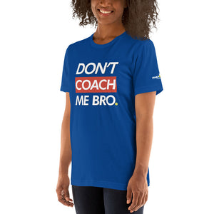 smiling woman with curly hair wearing royal blue don't coach me bro pickleball shirt apparel left side front view