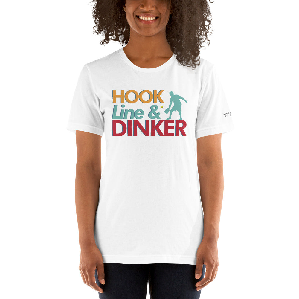 smiling woman wearing white hook line dinker pickleball shirt apparel front view
