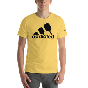 man wearing yellow addicted pickleball shirt