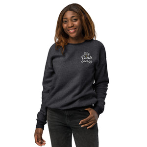 smiling woman wearing dark gray fleece embroidered big dink energy pickleball sweater apparel