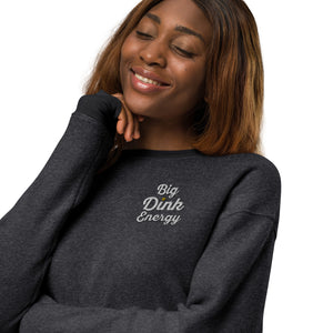 close up of smiling woman wearing dark gray fleece embroidered big dink energy pickleball sweater apparel