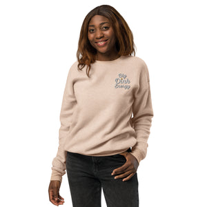 smiling woman wearing light peach fleece embroidered big dink energy pickleball sweater apparel
