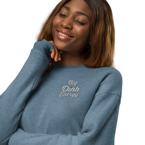 woman smiling wearing light blue embroidered fleece big dink energy pickleball sweater apparel