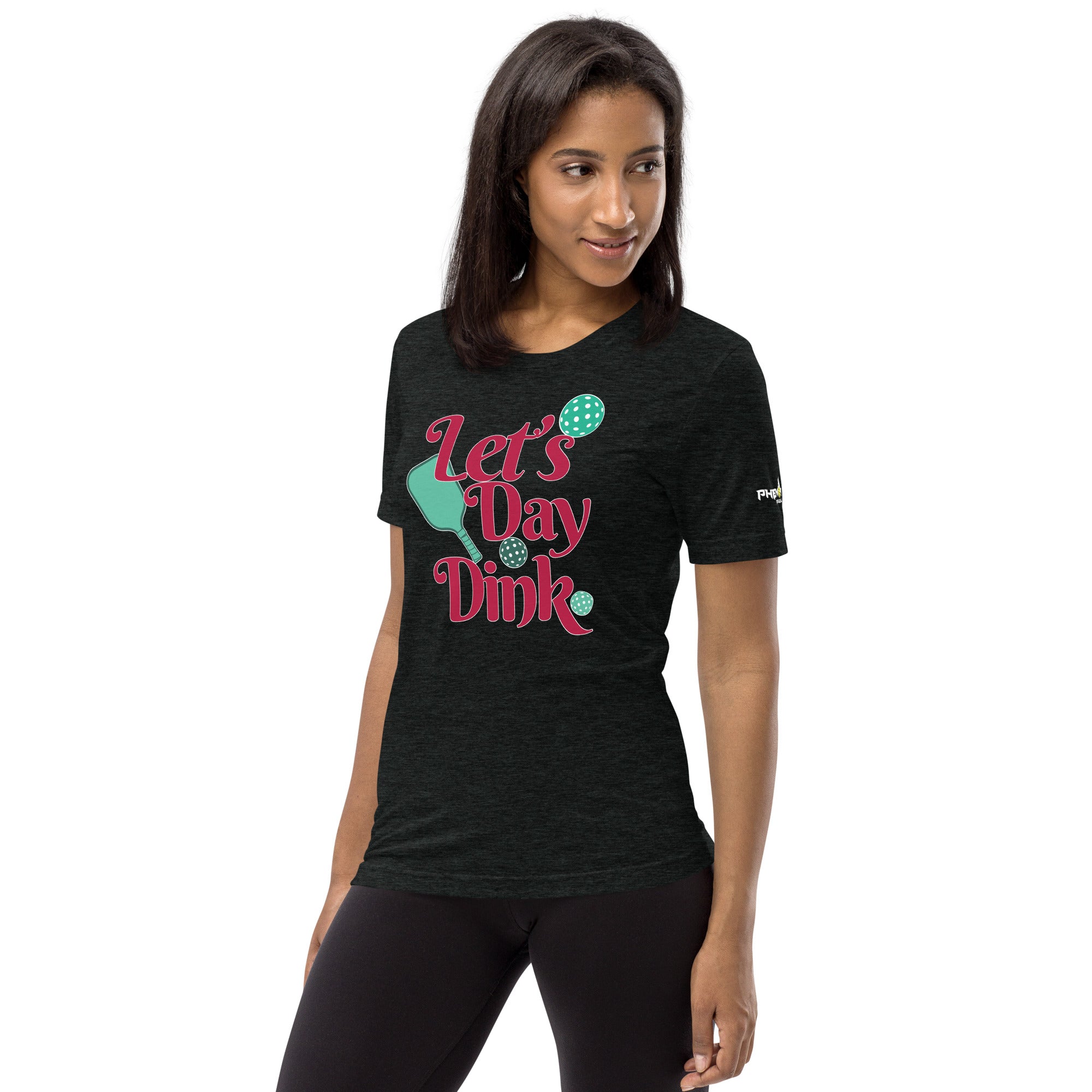 smiling woman looking to left wearing heather charcoal let's day dink pickleball shirt performance apparel athletic top left front view