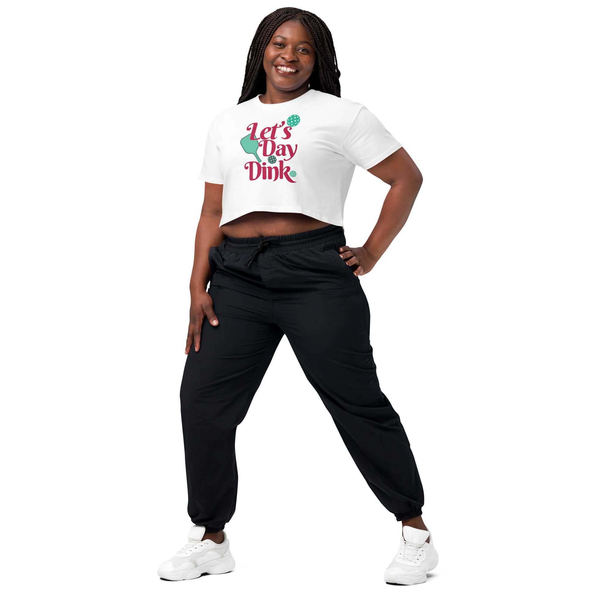 smiling plus sized woman wearing white let's day dink women's crop top pickleball apparel performance shirt athletic top front view