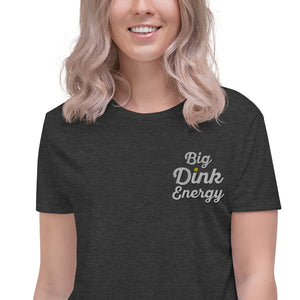 close up blonde woman wearing dark gray embroidered big dink energy womens crop pickleball apparel shirt