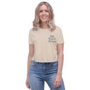 blonde woman wearing light cream embroidered big dink energy womens crop pickleball apparel shirt