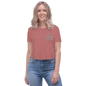 blonde woman wearing coral pink embroidered big dink energy womens crop pickleball apparel shirt