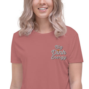 close up blonde woman wearing coral pink embroidered big dink energy womens crop pickleball apparel shirt