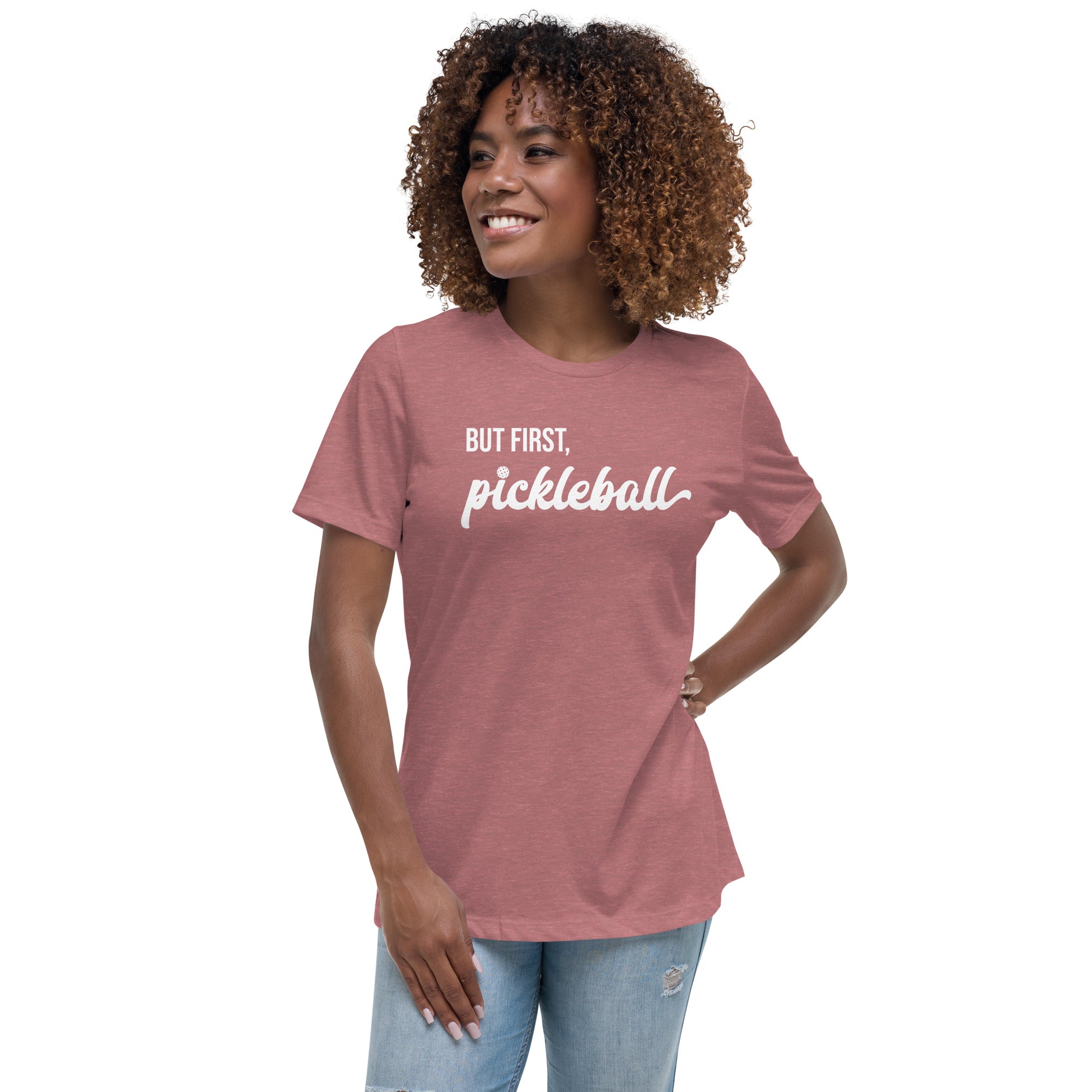 smiling woman with curly hair wearing toasted mauve women's but first pickleball shirt apparel front view